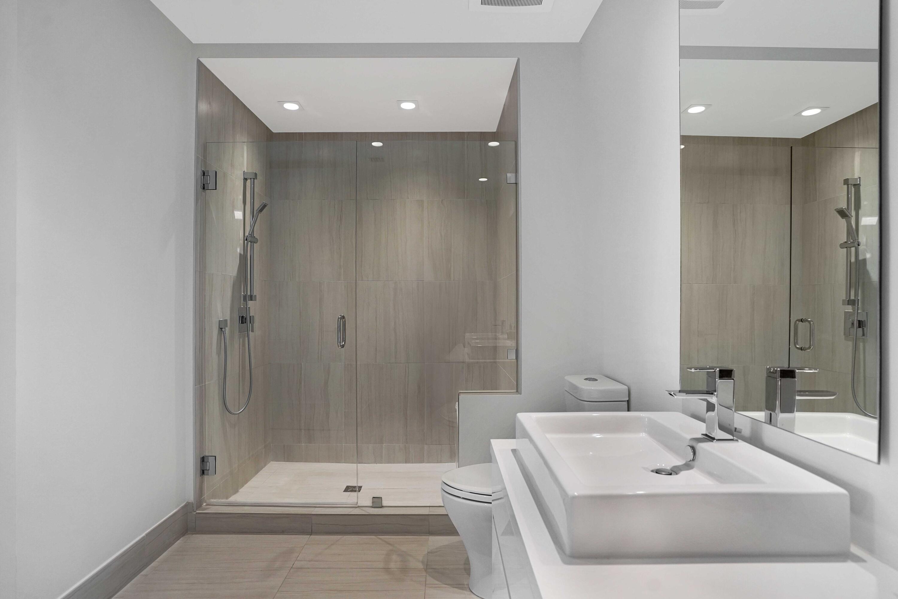 155 East Boca Raton Road, Unit 822 Boca Raton, FL 33432 - Photo 35 of 73 a bathroom with a sink a toilet and shower