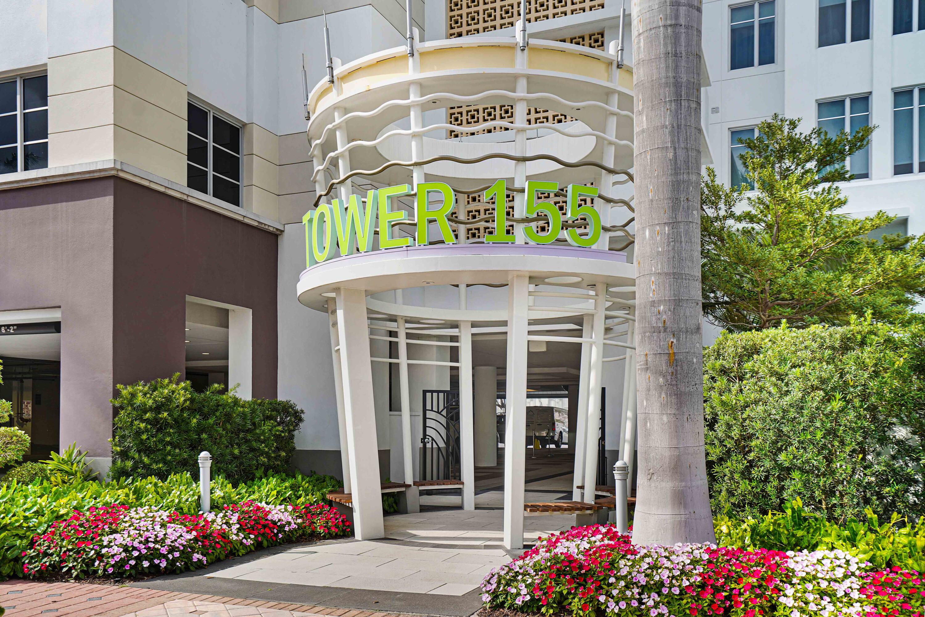 155 East Boca Raton Road, Unit 822 Boca Raton, FL 33432 - Photo 55 of 73 a front view of a building with flowers