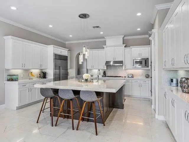 an aerial view of a residential houses with outdoor space