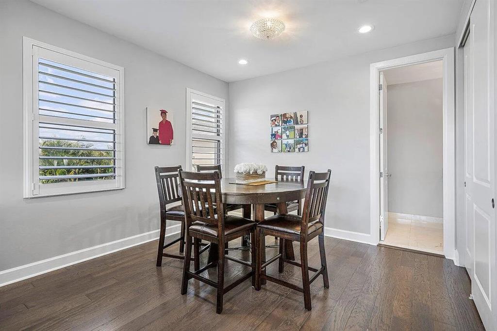17511 Cadena Drive Boca Raton, FL 33496 - Photo 28 of 62 a view of a dining room with furniture and wooden floor