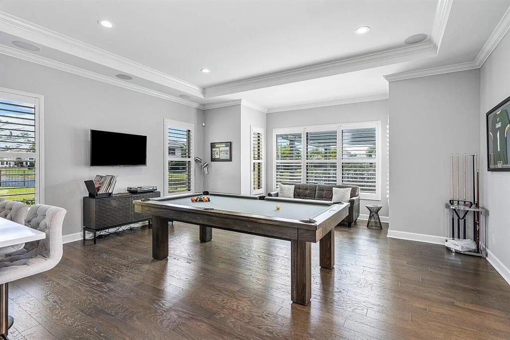 17511 Cadena Drive Boca Raton, FL 33496 - Photo 29 of 62 a living room with furniture flat screen tv and wooden floor
