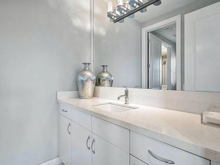 17511 Cadena Drive Boca Raton, FL 33496 - Photo 34 of 62 a bathroom with a sink and a mirror