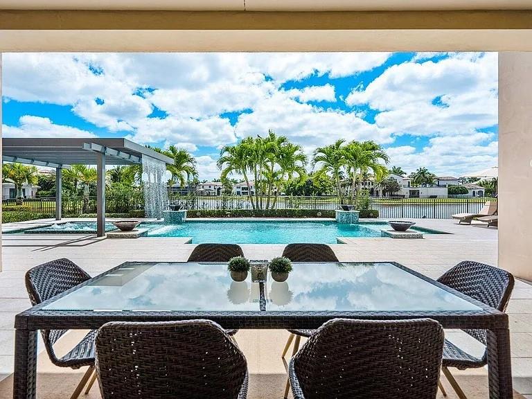 17511 Cadena Drive Boca Raton, FL 33496 - Photo 39 of 62 a view of yard with seating area and car parked