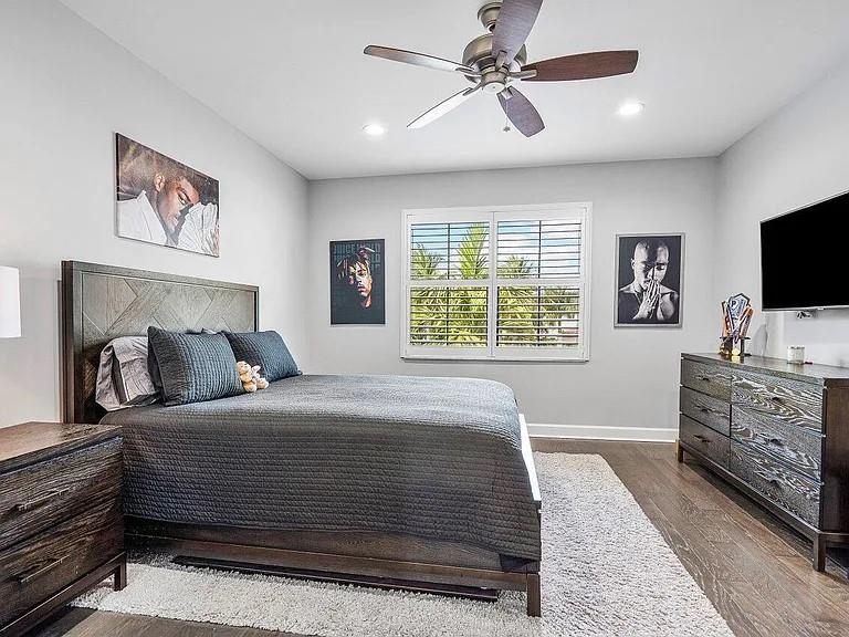 17511 Cadena Drive Boca Raton, FL 33496 - Photo 47 of 62 a bedroom with a large bed a flat tv screen and a dresser