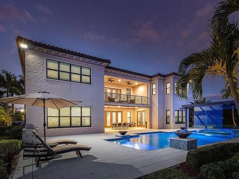 17511 Cadena Drive Boca Raton, FL 33496 - Photo 54 of 62 a swimming pool with outdoor seating