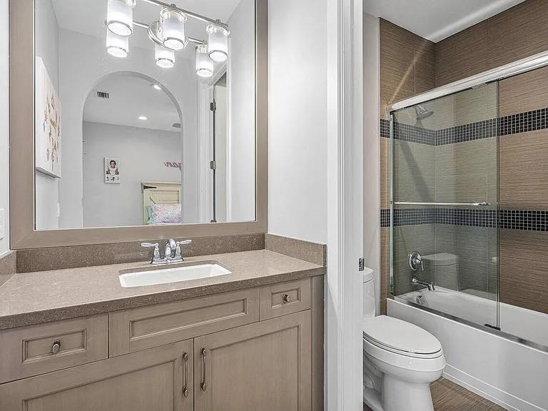 17511 Cadena Drive Boca Raton, FL 33496 - Photo 57 of 62 a bathroom with a sink a toilet and shower