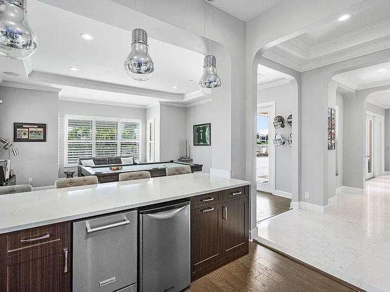17511 Cadena Drive Boca Raton, FL 33496 - Photo 60 of 62 a kitchen with a sink and a refrigerator
