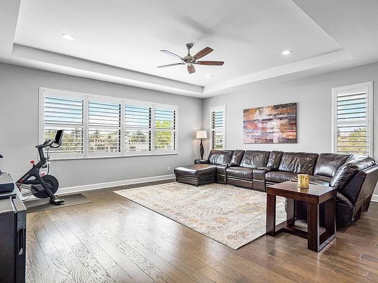 17511 Cadena Drive Boca Raton, FL 33496 - Photo 8 of 62 a living room with furniture a window and a flat screen tv