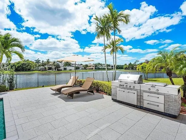 a view of a swimming pool with a patio