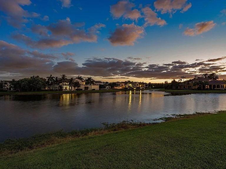 17511 Cadena Drive Boca Raton, FL 33496 - Photo 9 of 62 a view of a lake with houses in the background