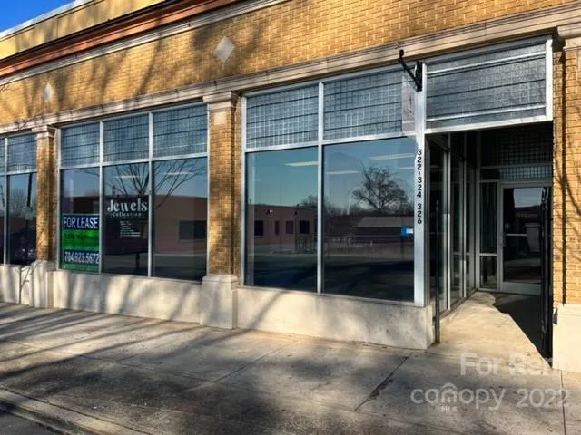 a view of entrance gate of the building and living room