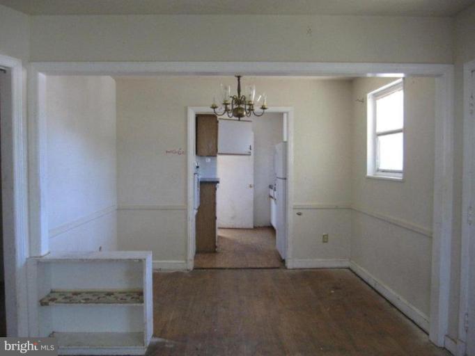 8615 Riggs Road Hyattsville, MD 20783 - Photo 3 of 7 a view of entryway and hall with a window