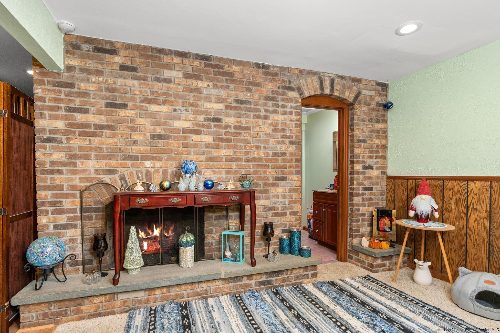 154 Mountain View Road Tillson, NY 12486 - Photo 15 of 25 a man sitting on a bench in front of a building