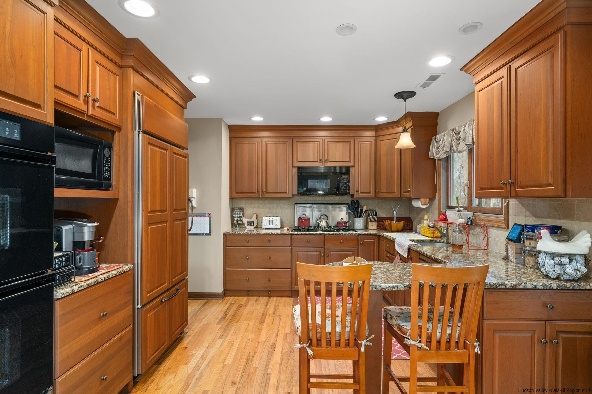 154 Mountain View Road Tillson, NY 12486 - Photo 6 of 25 a kitchen with stainless steel appliances granite countertop a refrigerator a stove top oven and a sink