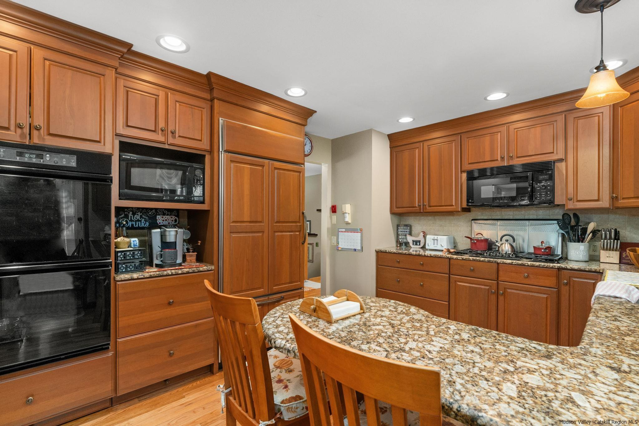 154 Mountain View Road Tillson, NY 12486 - Photo 7 of 25 a kitchen with stainless steel appliances granite countertop a refrigerator and a stove top oven
