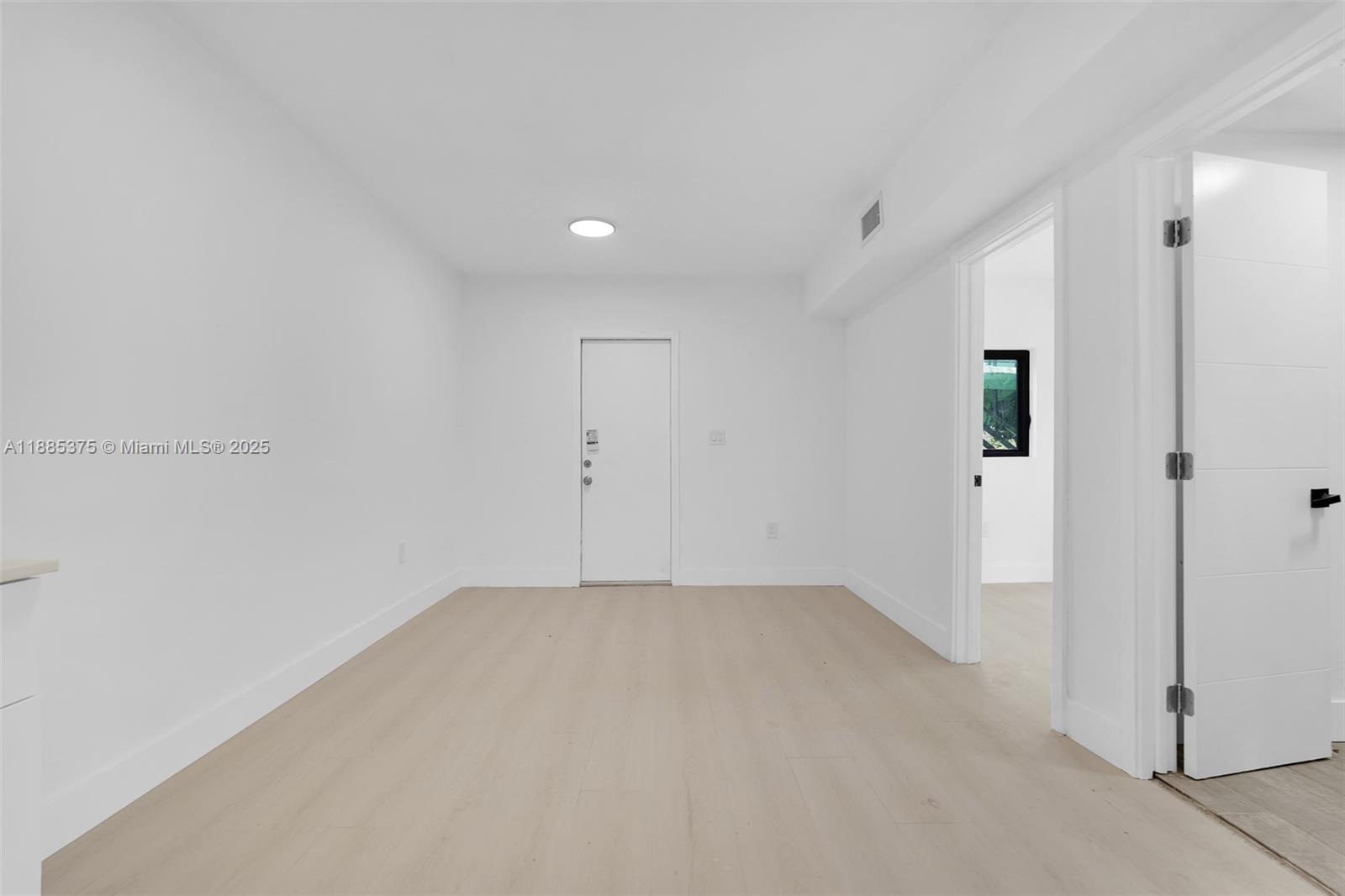 1814 Northwest 2nd Court, Unit 4 Miami, FL 33136 - Photo 8 of 13 wooden floor in an empty room