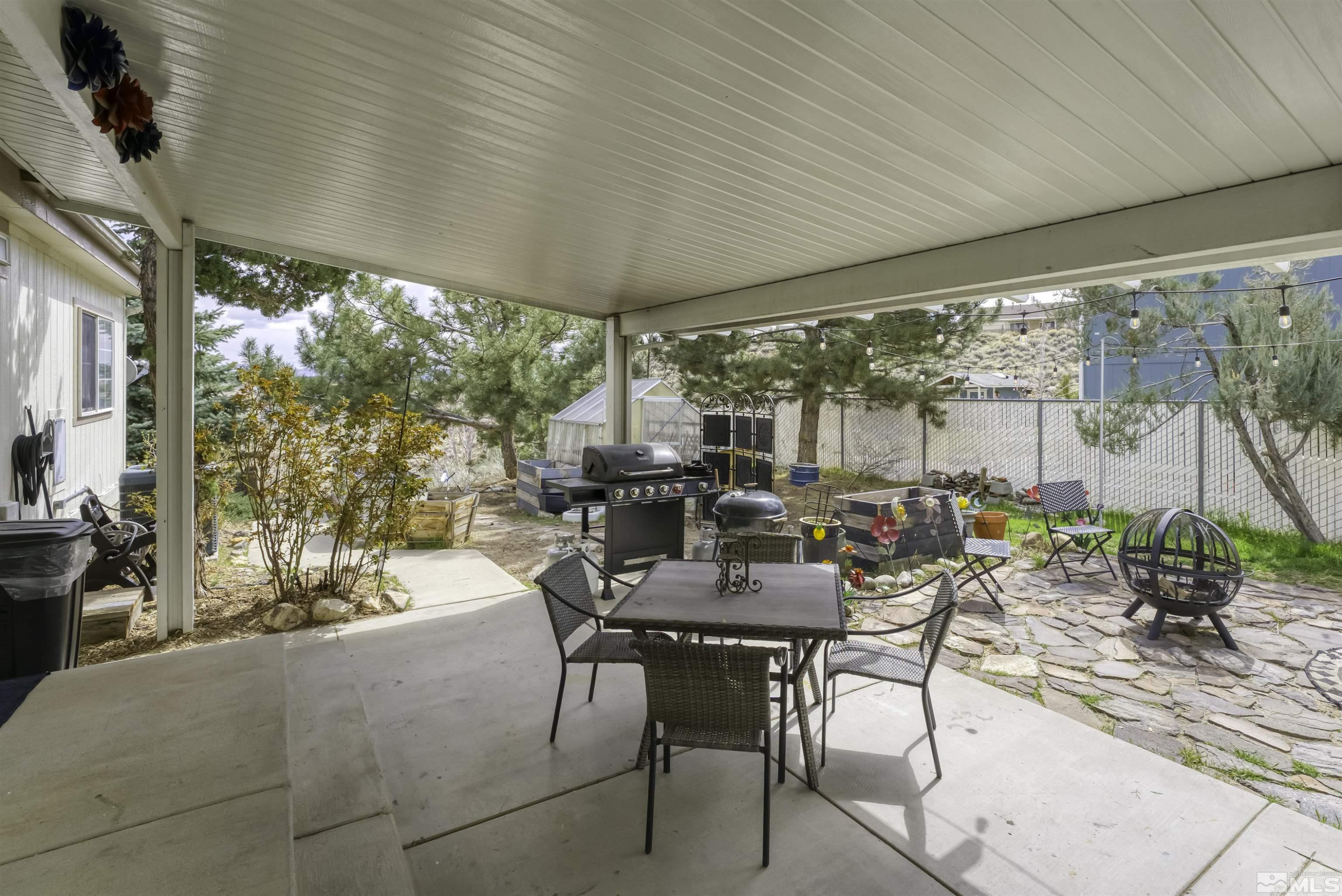 5158 Denali Way Reno, NV 89506 - Photo 15 of 24 a outdoor dining space with furniture and garden view