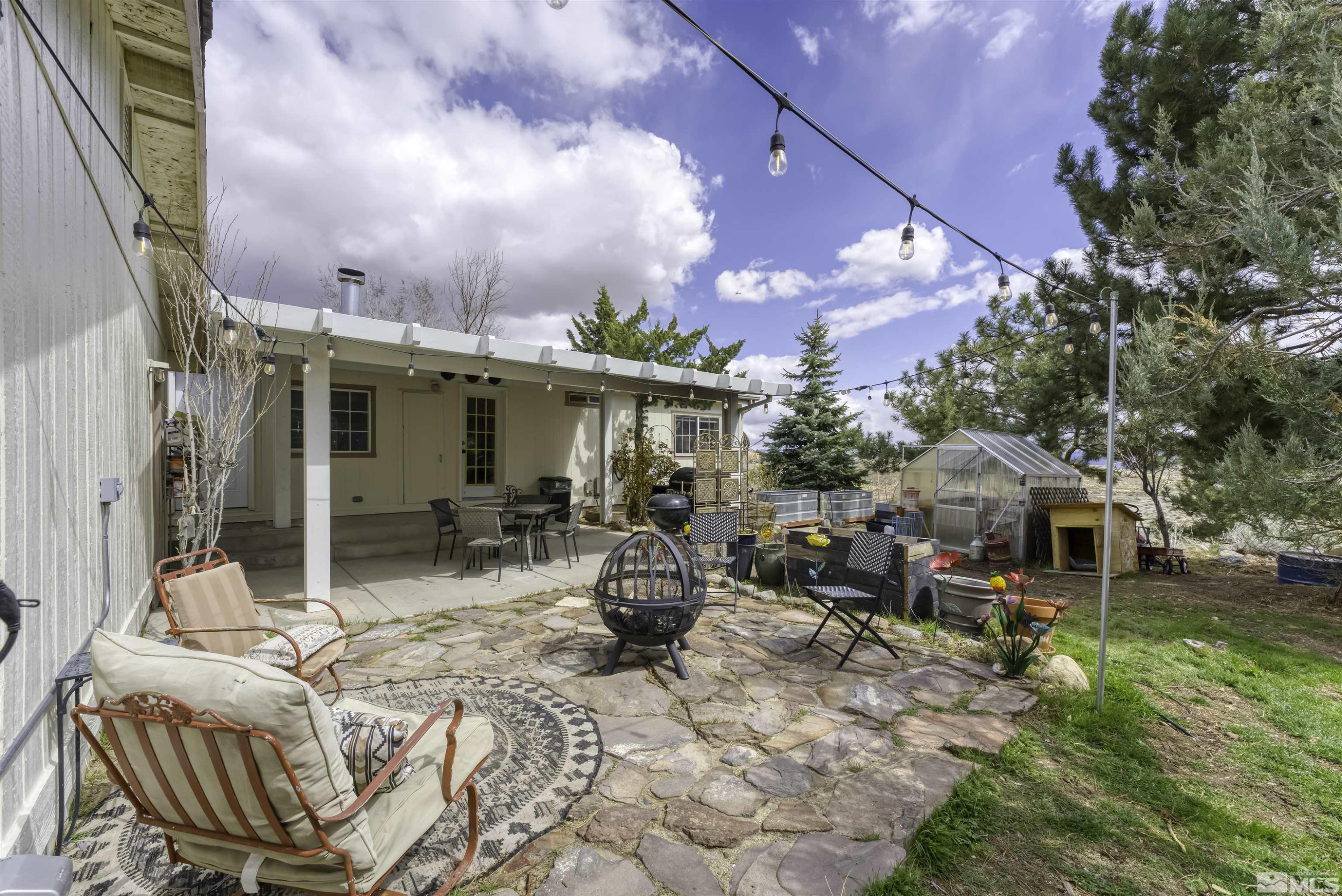 5158 Denali Way Reno, NV 89506 - Photo 16 of 24 a view of a patio with table and chairs and potted plants