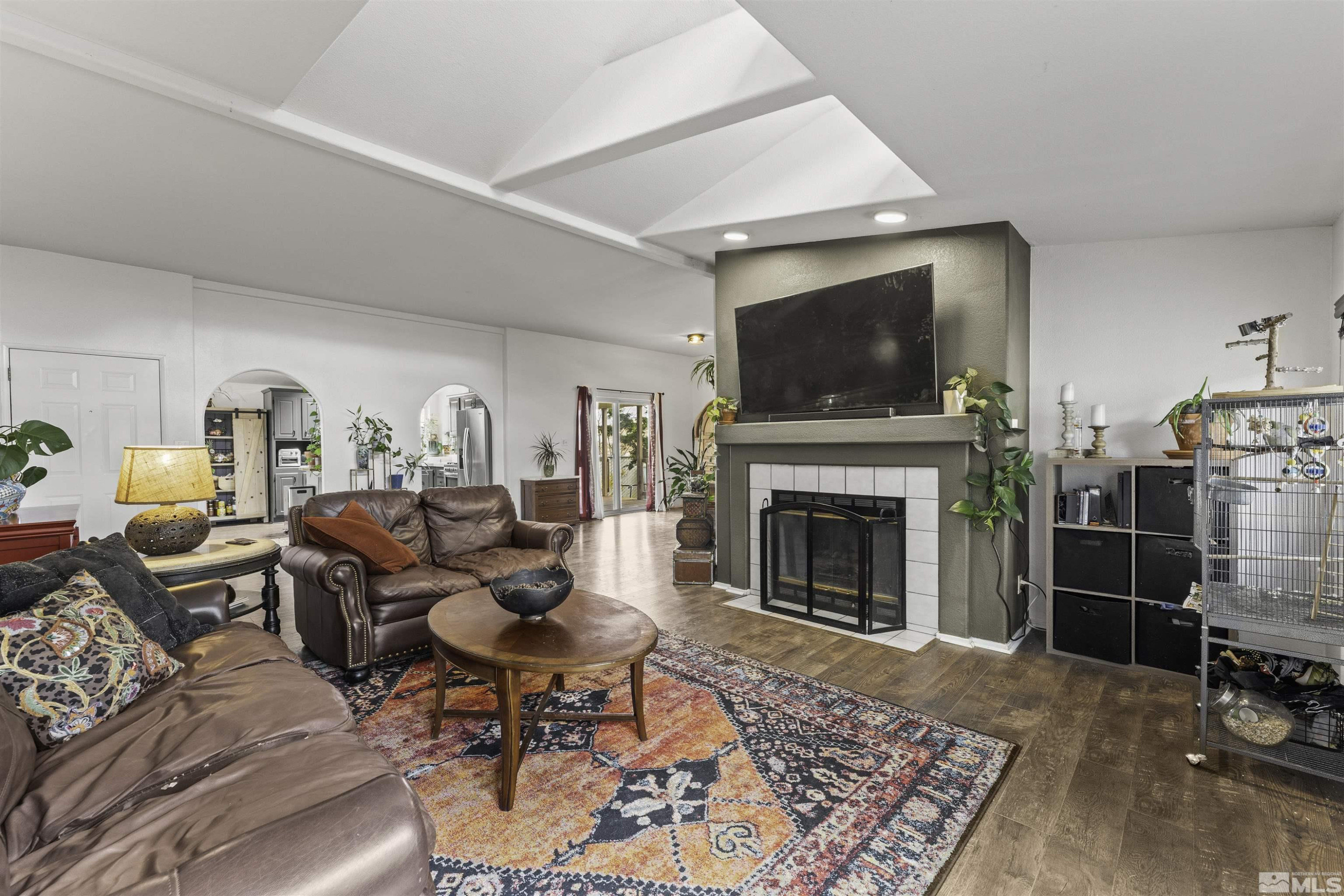 5158 Denali Way Reno, NV 89506 - Photo 5 of 24 a living room with furniture a flat screen tv and a fireplace