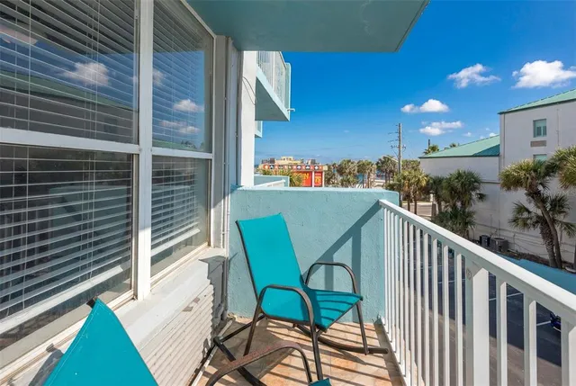 a view of a balcony with potted plants