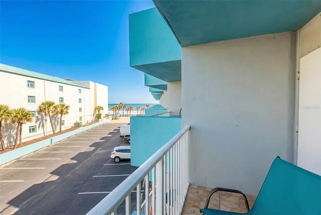 a lobby with furniture and a glass door