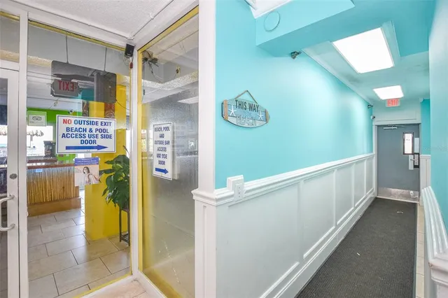 a living room with furniture and a open to kitchen