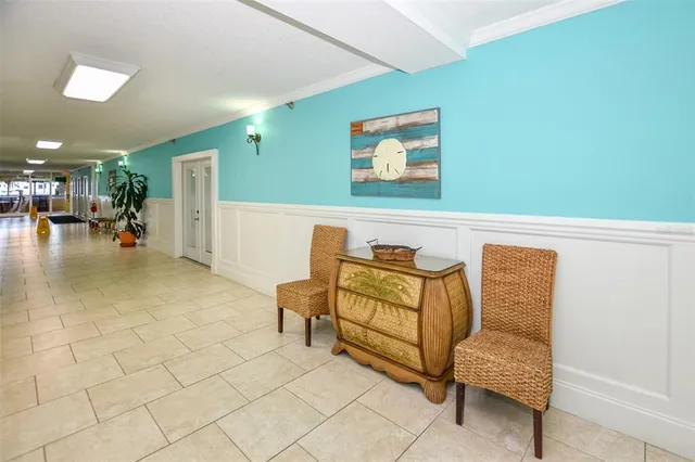 a view of a patio with dining table and chairs