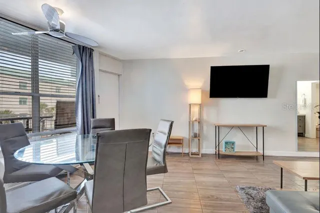 a view of a livingroom with furniture and a flat screen tv
