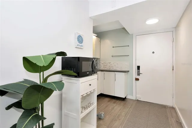 a kitchen with stainless steel appliances cabinets and a counter top space