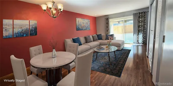 a living room with furniture a chandelier and a window