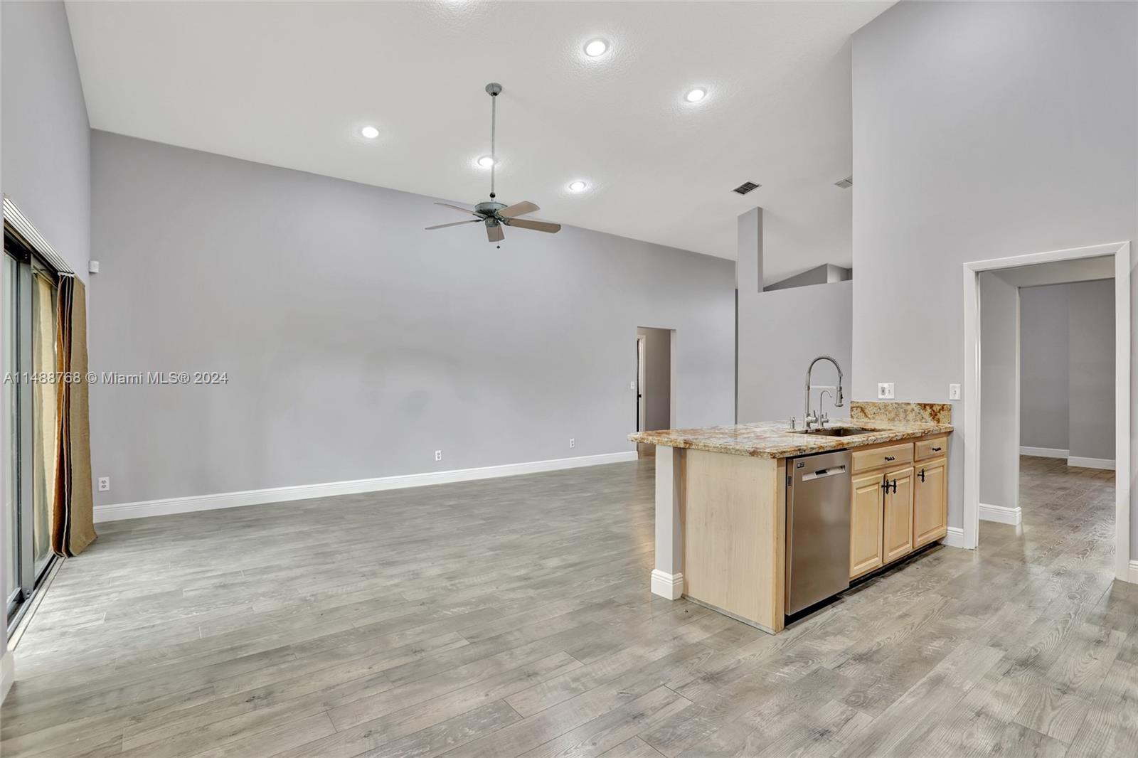 9641 Ridgeside Court Davie, FL 33328 - Photo 12 of 47 a kitchen with a stove and a refrigerator