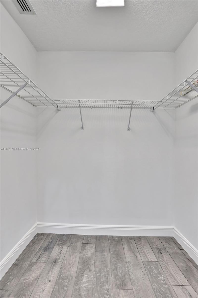 9641 Ridgeside Court Davie, FL 33328 - Photo 15 of 47 a view of a room with racks on the wall