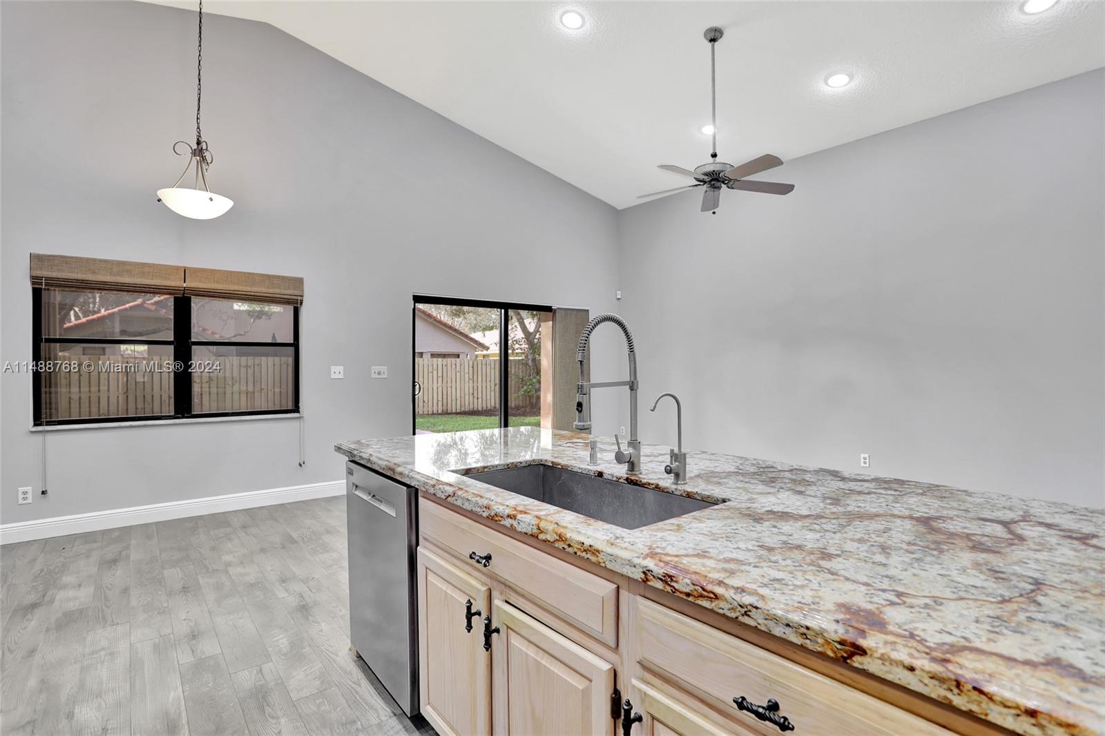 9641 Ridgeside Court Davie, FL 33328 - Photo 21 of 47 a bathroom with a granite countertop sink a large mirror and shower