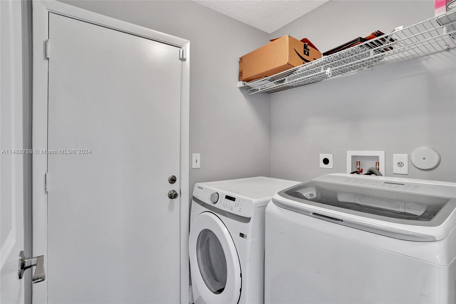 9641 Ridgeside Court Davie, FL 33328 - Photo 23 of 47 a utility room with dryer and washer