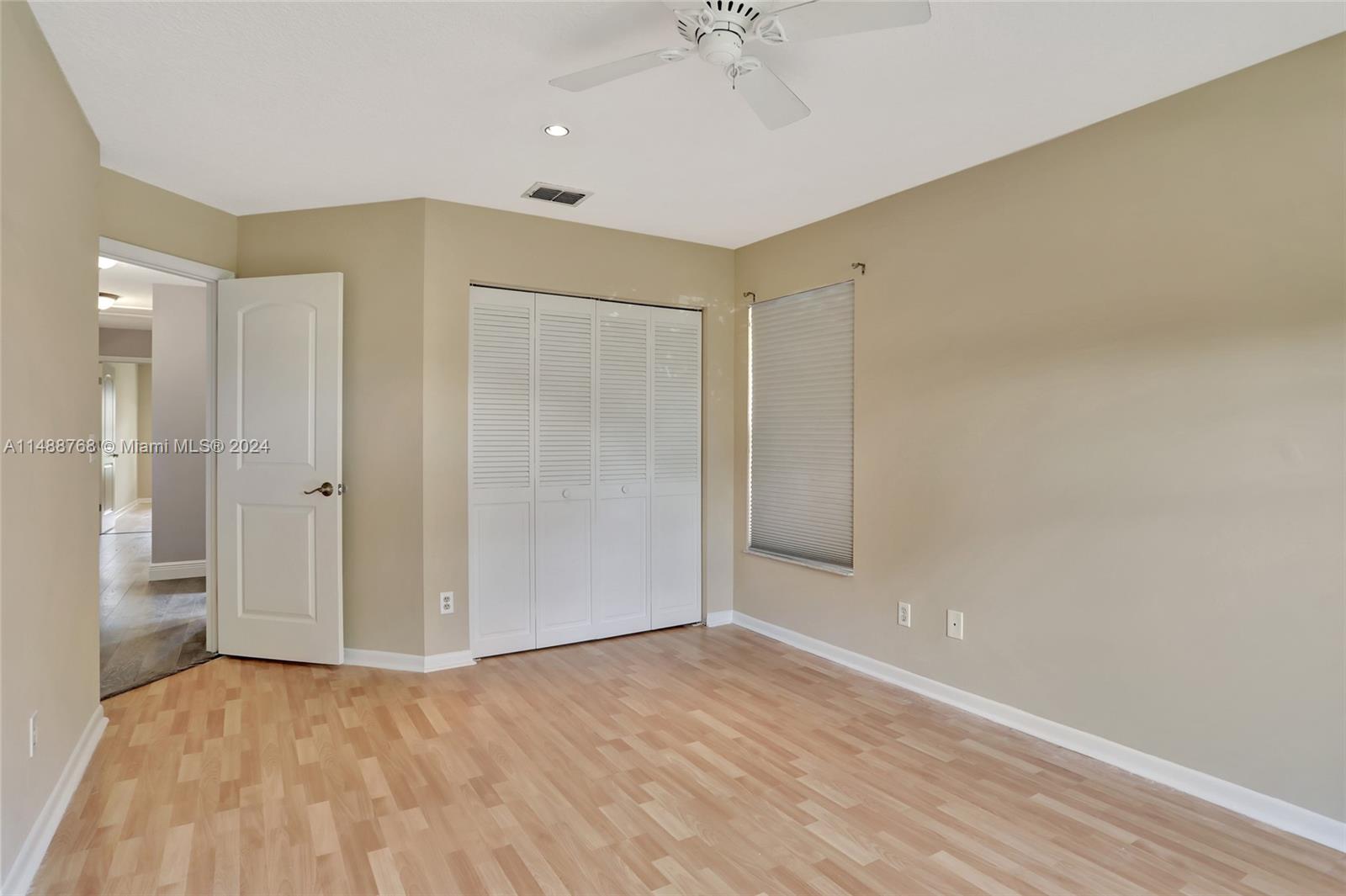 9641 Ridgeside Court Davie, FL 33328 - Photo 27 of 47 an empty room with a empty space and windows