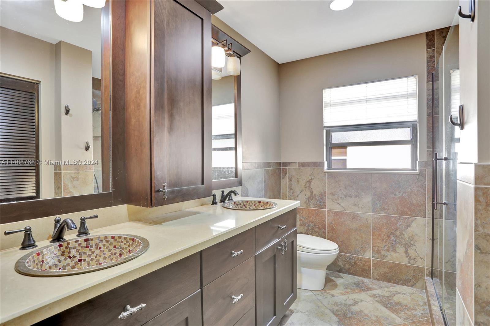 9641 Ridgeside Court Davie, FL 33328 - Photo 28 of 47 a bathroom with a granite countertop sink and a mirror