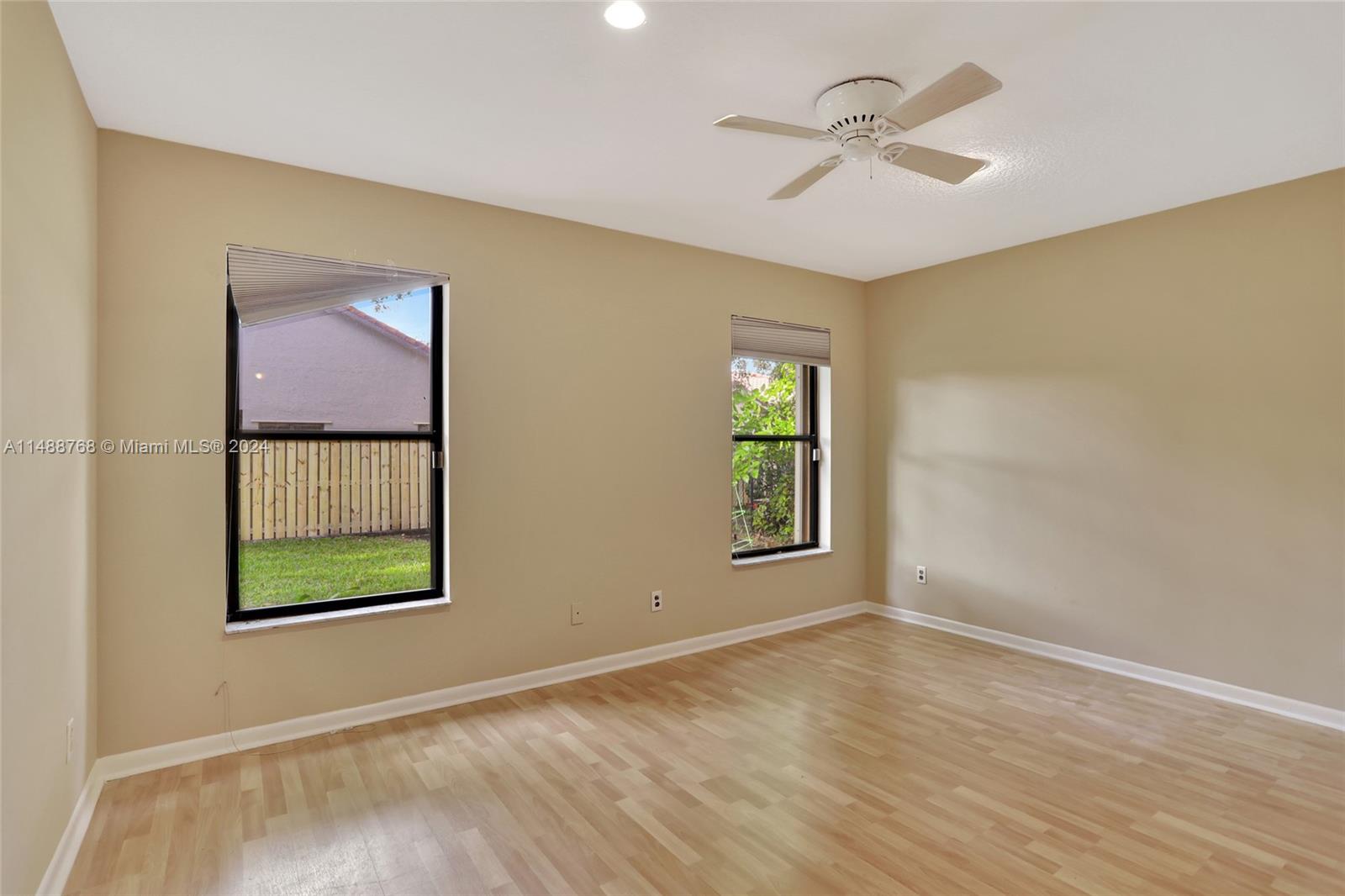 9641 Ridgeside Court Davie, FL 33328 - Photo 33 of 47 a view of an empty room with a window and a ceiling fan