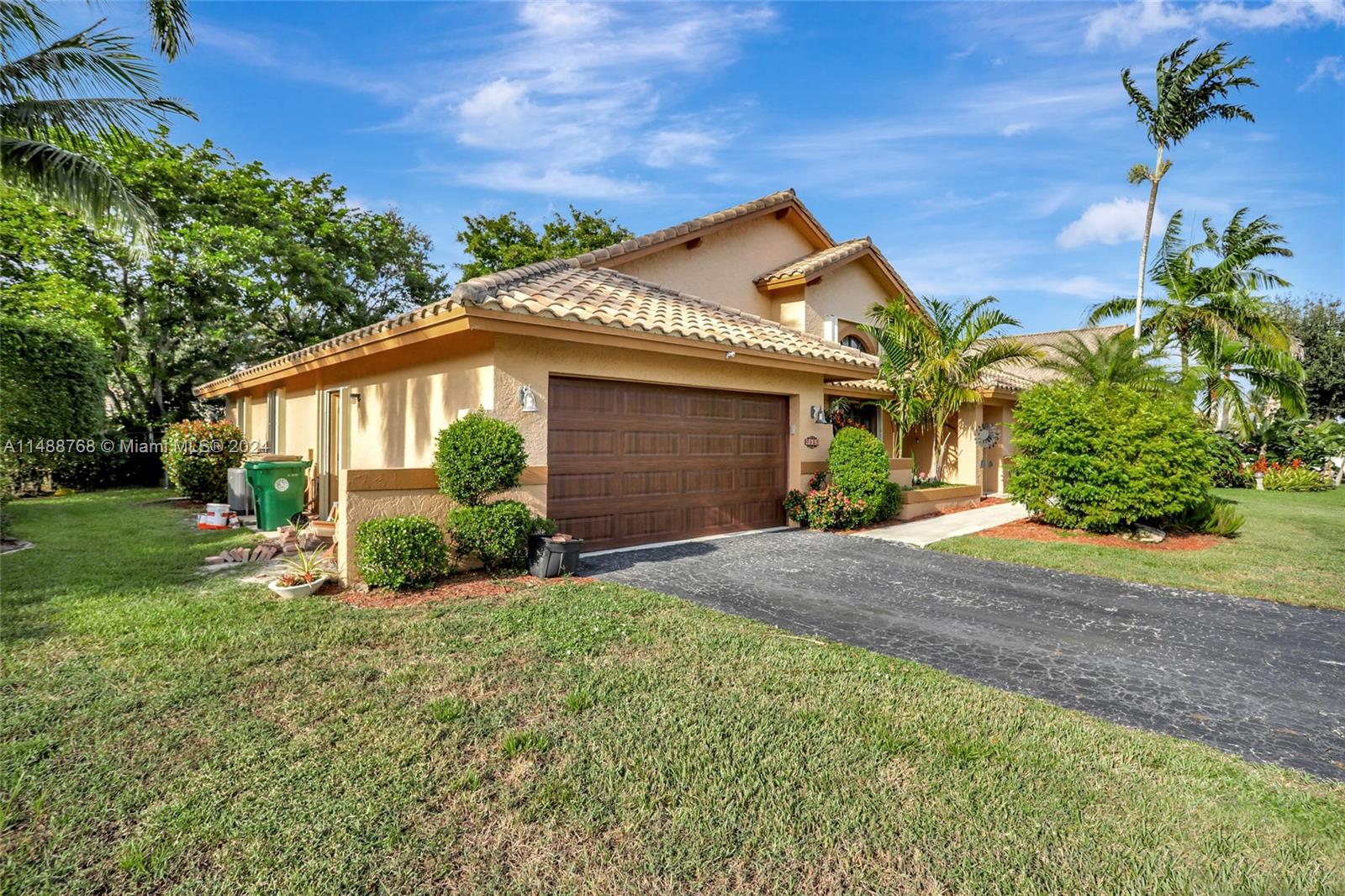9641 Ridgeside Court Davie, FL 33328 - Photo 39 of 47 a front view of a house with garden