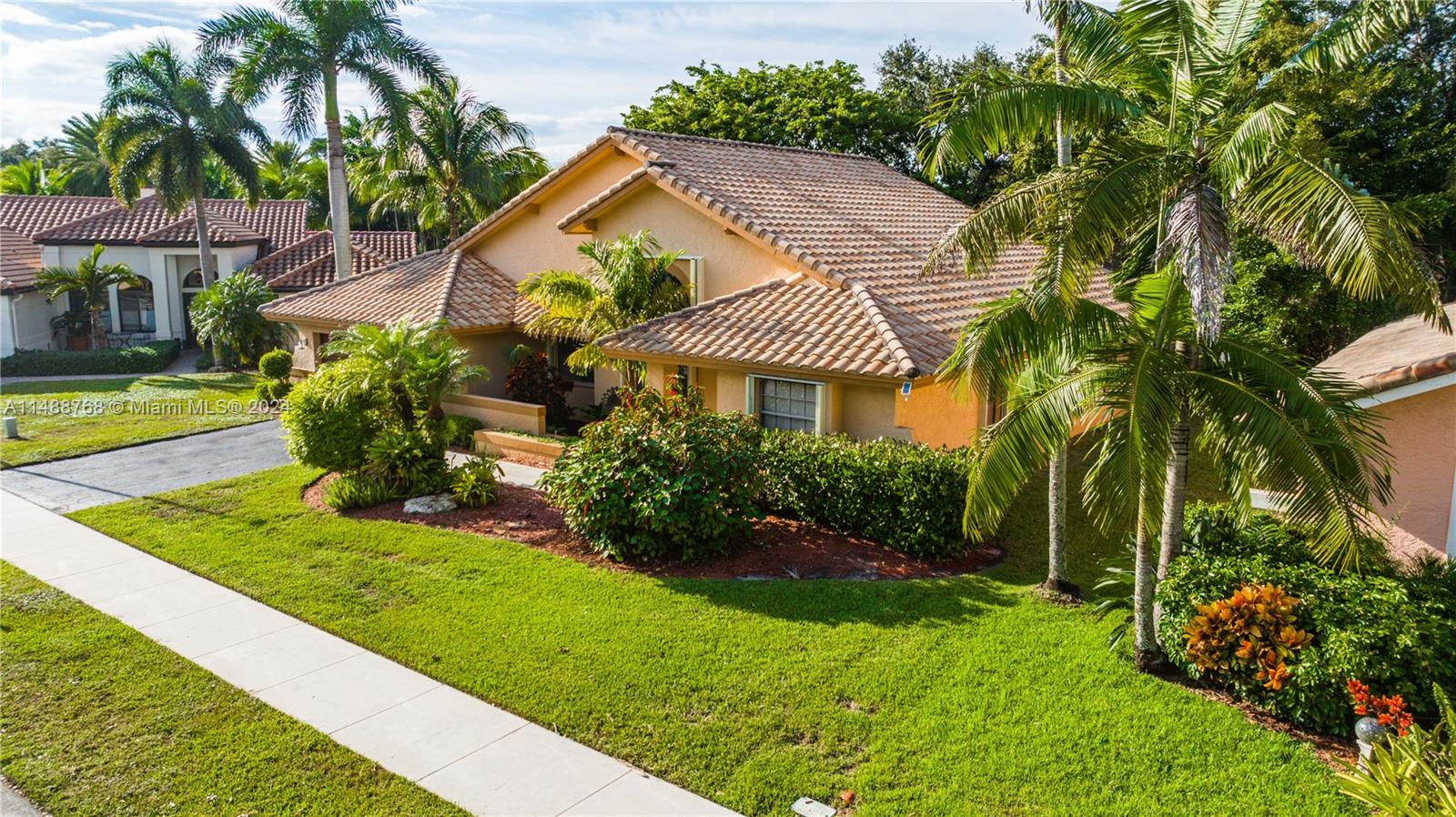 9641 Ridgeside Court Davie, FL 33328 - Photo 43 of 47 a front view of a house with a yard