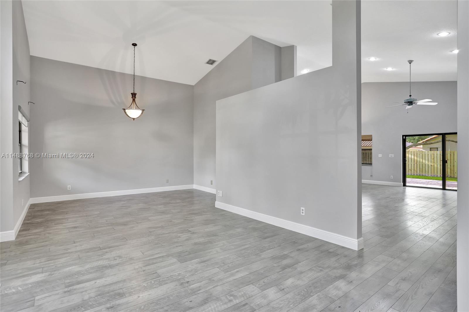9641 Ridgeside Court Davie, FL 33328 - Photo 8 of 47 a view of a livingroom with a ceiling fan window and wooden floor