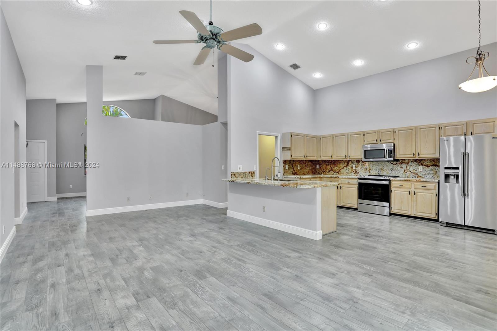 9641 Ridgeside Court Davie, FL 33328 - Photo 10 of 47 a view of kitchen with wooden floor and electronic appliances