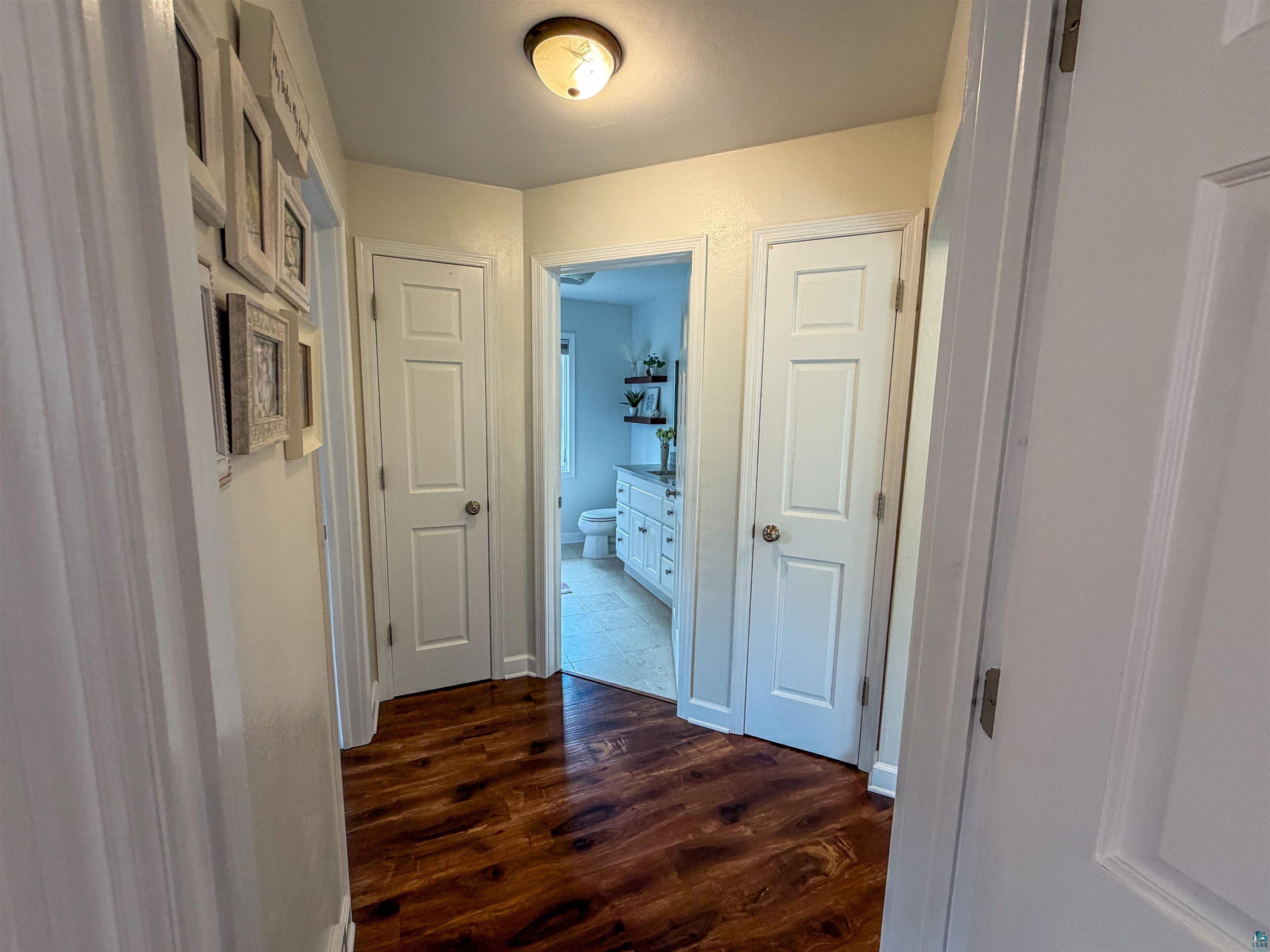 3704 Greysolon Road Duluth, MN 55804 - Photo 14 of 51 Hallway featuring wood-finish flooring, recessed lighting, and white paneled doors