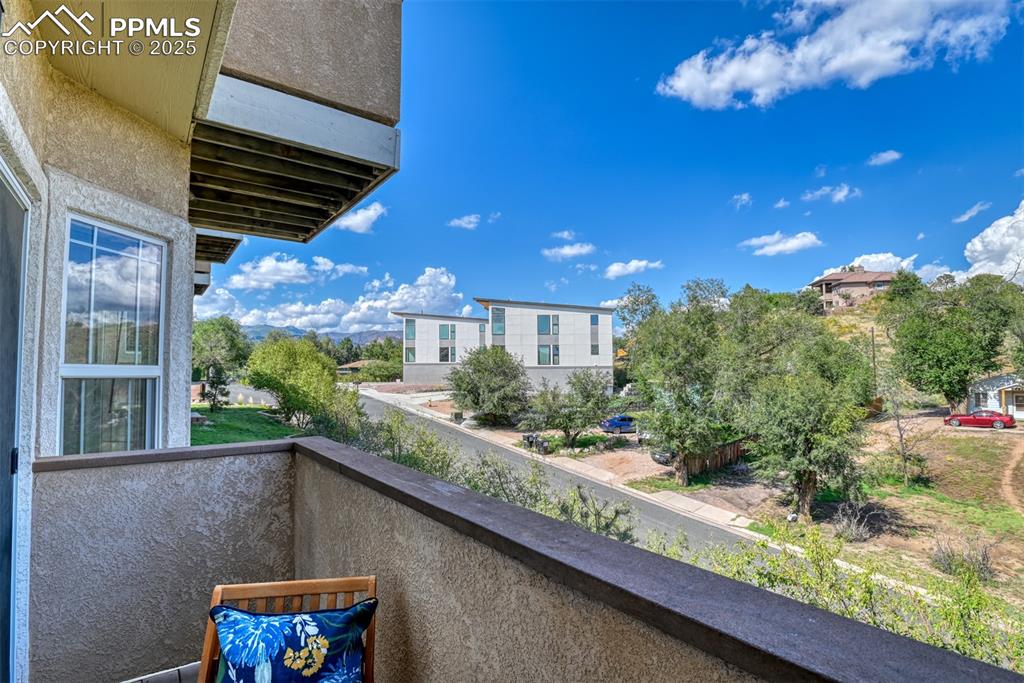 1431 Madison Ridge Heights, Unit C Colorado Springs, CO 80904 - Photo 13 of 44 a front view of a house with a yard