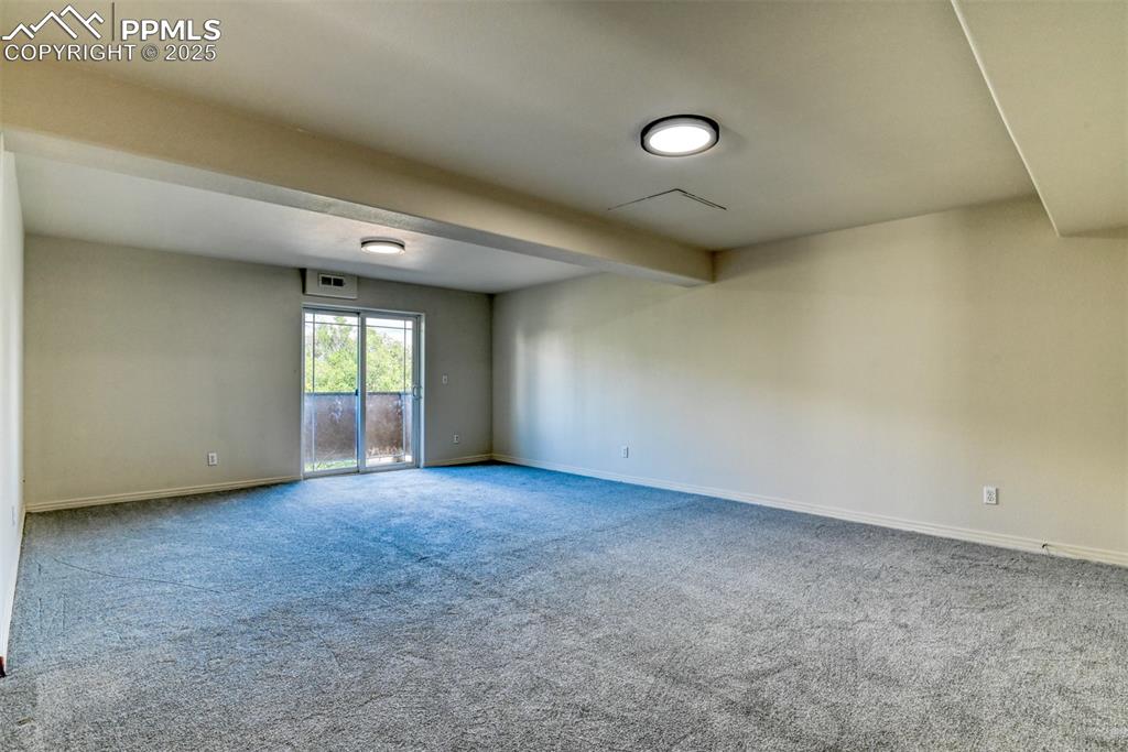 1431 Madison Ridge Heights, Unit C Colorado Springs, CO 80904 - Photo 30 of 44 an empty room with windows