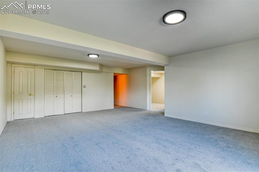 1431 Madison Ridge Heights, Unit C Colorado Springs, CO 80904 - Photo 32 of 44 an empty room with a window