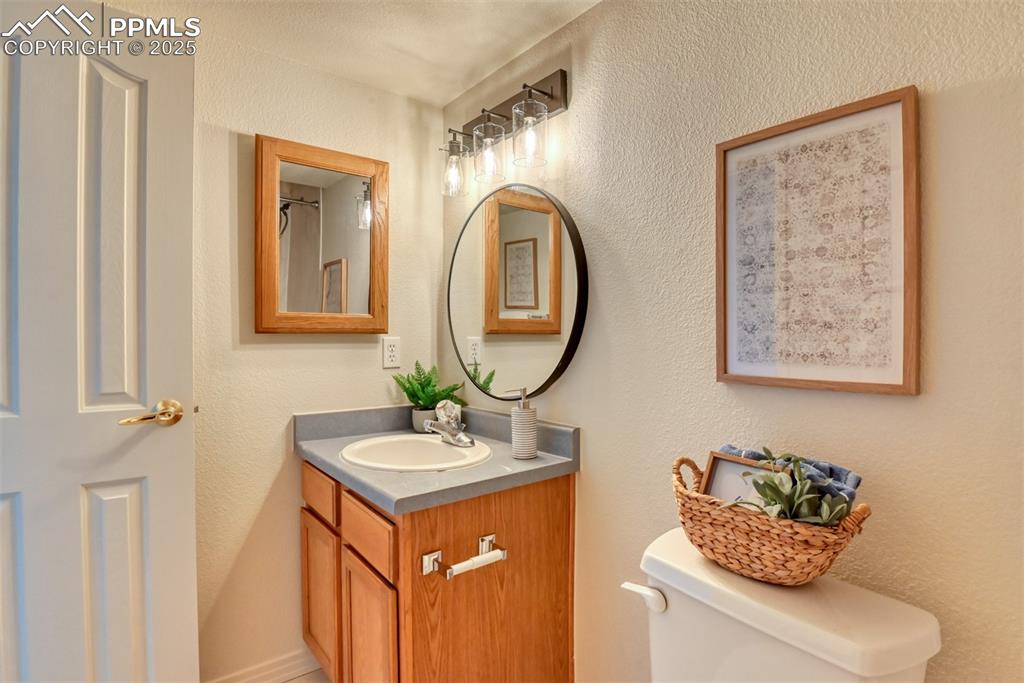 1431 Madison Ridge Heights, Unit C Colorado Springs, CO 80904 - Photo 39 of 44 a bathroom with a sink and a mirror