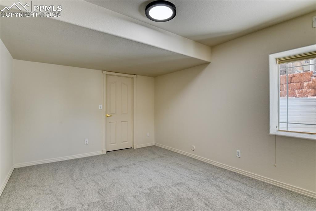1431 Madison Ridge Heights, Unit C Colorado Springs, CO 80904 - Photo 40 of 44 an empty room with windows