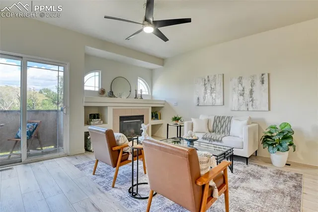 a view of a livingroom with furniture and a fireplace