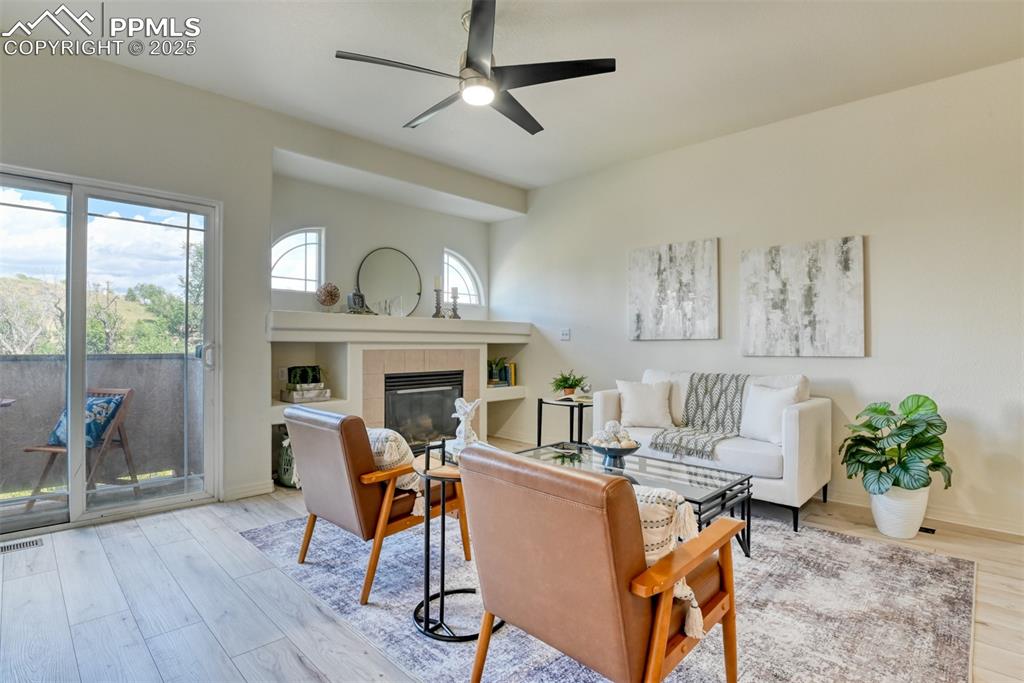 1431 Madison Ridge Heights, Unit C Colorado Springs, CO 80904 - Photo 4 of 44 a view of a livingroom with furniture and a fireplace