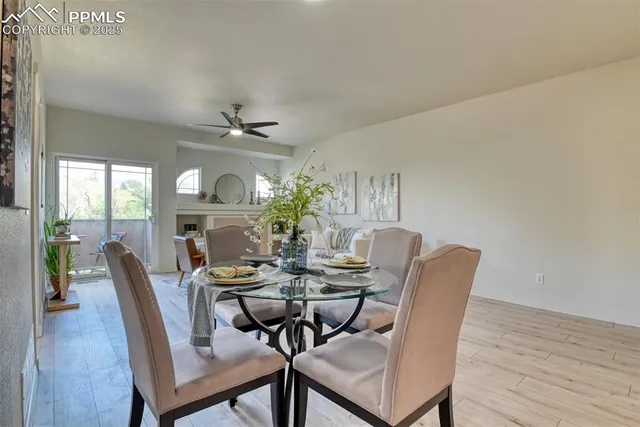 a view of a dining room with furniture window and wooden floor